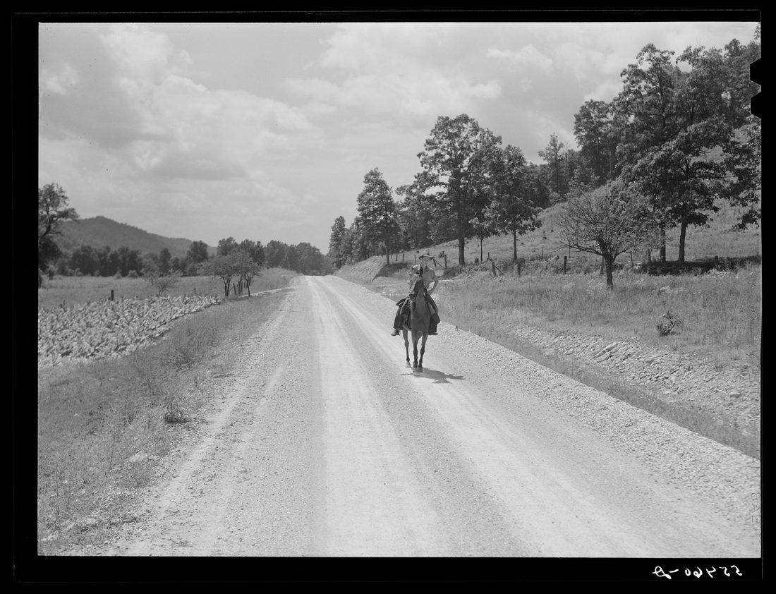 Rural mailman riding to the crossroads where he will meet another postman in a wagon. The mail sacks will then be transferred to his saddlebags and he will take the mail further up