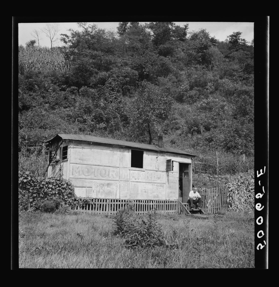 Unemployed miner's home he built. "It'll be purtier when I paint it." Scott's Run, West Virginia. Osage, West Virginia