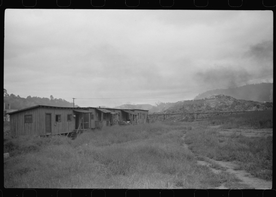 Section of Rosedale Mining Company. Shanties by the river (burning slag pile to right). These used to be United Mine Workers barracks just thrown up to temporarily house men thrown