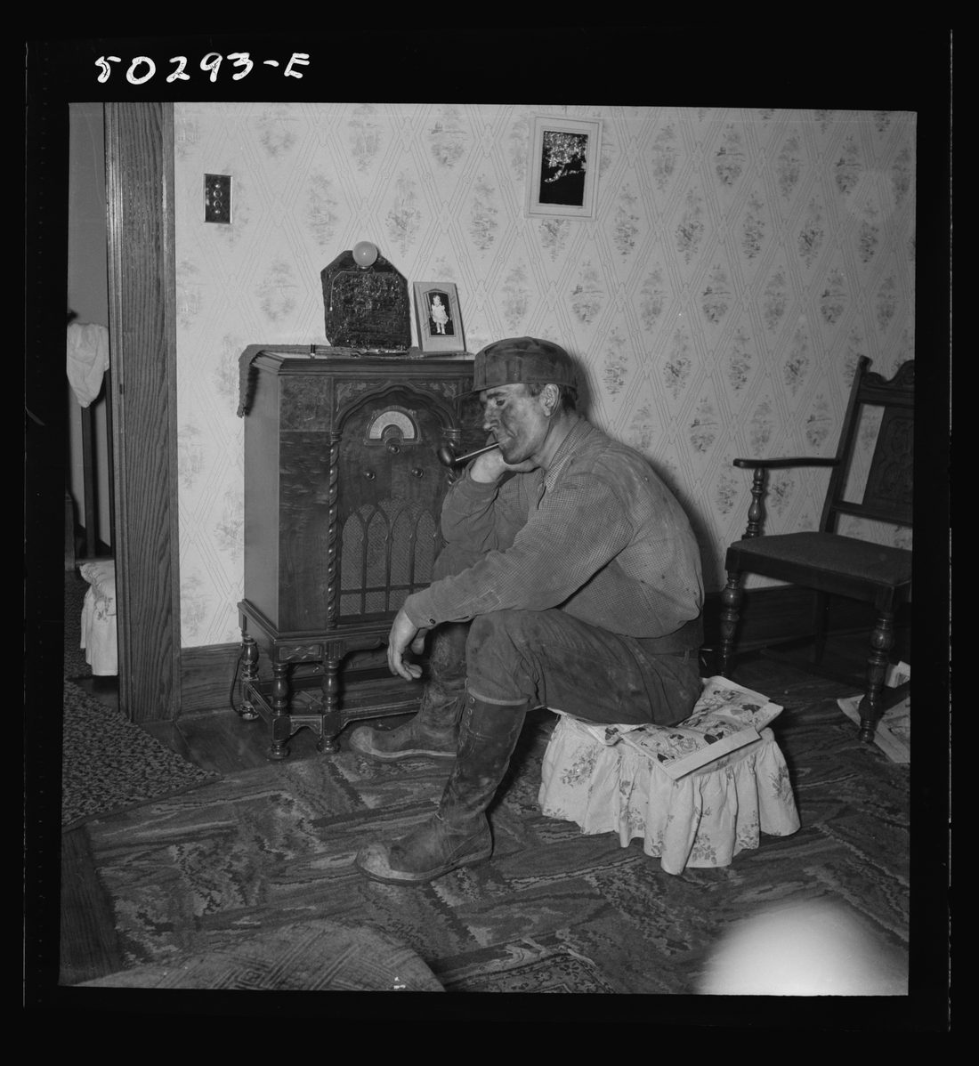 A more well-to-do miner listening to the radio when he returns home in the morning after working on the night shift. He is Polish, his wife Hungarian. These "foreigners" 