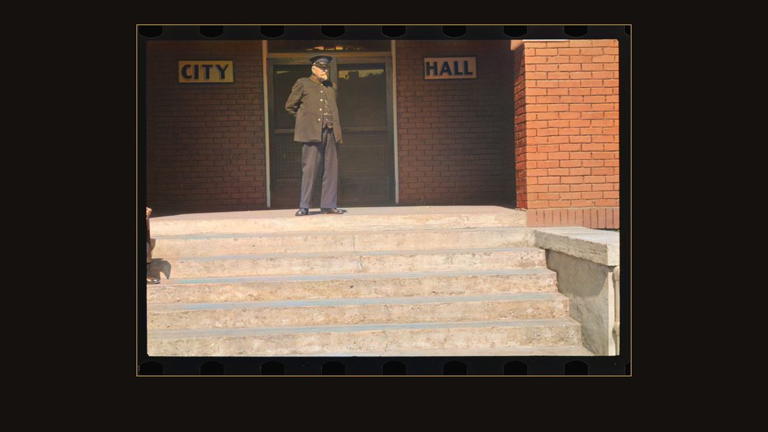 Old fireman in front of city hall, Maynardville, Tennessee