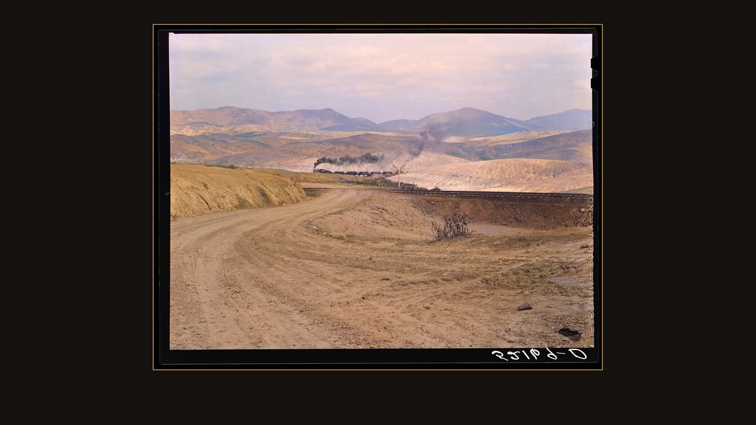 Train bringing copper ore out of mine. Ducktown, Tennessee. Fumes from smelting copper for sulfuric acid have destroyed all vegetation and eroded the land