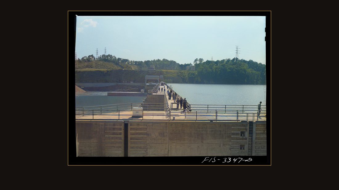 Watts Bar Dam, Tennessee. Tennessee Valley Authority (TVA). Workers crossing the dam