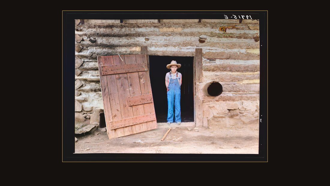 North Carolina farm boy in doorway of tobacco barn. Person County, North Carolina