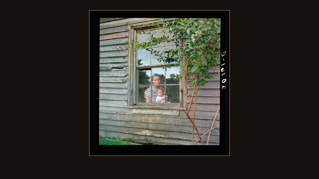 Wife and five month old baby of young tobacco sharecropper (Mr. Taylor) in window of their home. She is seventeen years old. On the following day she helped "put in" toba