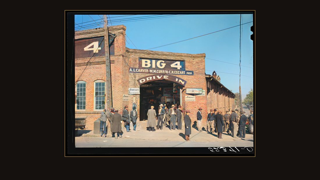 Farmers waiting around outside warehouse during tobacco auction sale. Durham, North Carolina