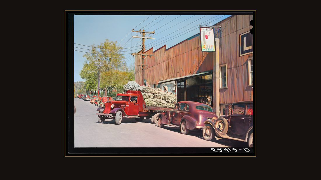 Tobacco is taken in trucks from warehouse to cigarette factories. Durham, North Carolina
