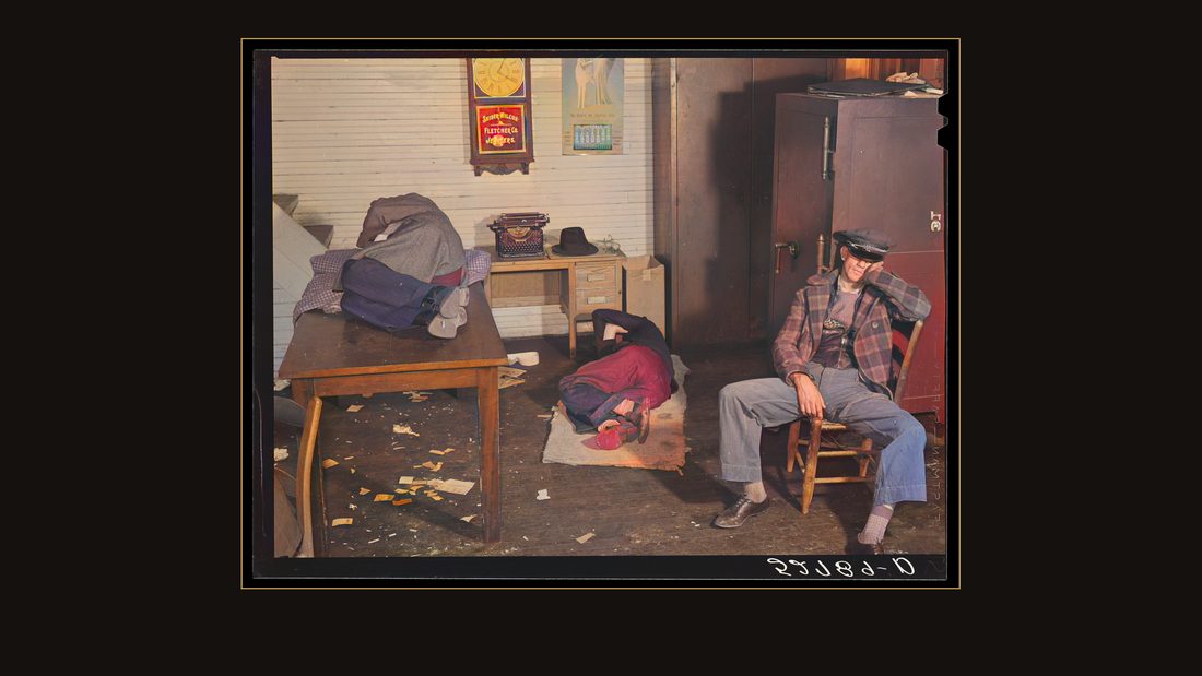Farmers must often wait overnight before their tobacco is sold at auction. They sleep most anywhere. This is interior of the office in the warehouse about four o'clock in the