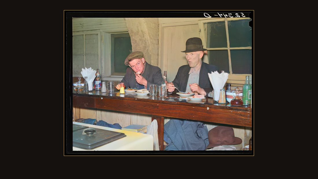 Farmers eating in cafe under tobacco warehouse during auction sale. Durham, North Carolina