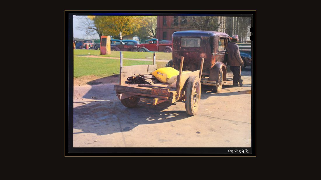 Farmer returning home after selling his tobacco at auction. In the trailer are sacks of flour and meal and the tobacco sticks. Yanceyville, Caswell County, North Carolina