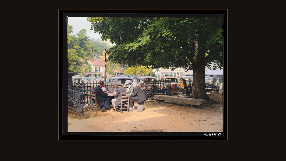Men playing cards in yard in front of court house in Yanceyville, Caswell County, North Carolina