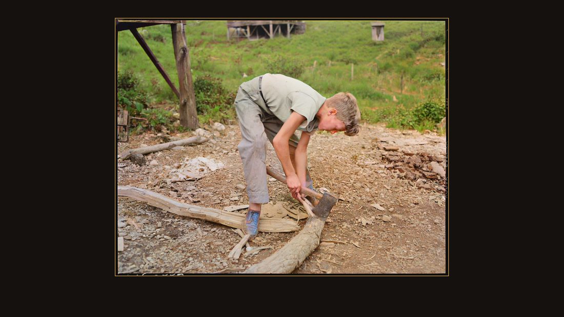 Franklin D. Sergent chopping kindling. P V & K Coal Company, Clover Gap Mine, Lejunior, Harlan County, Kentucky.