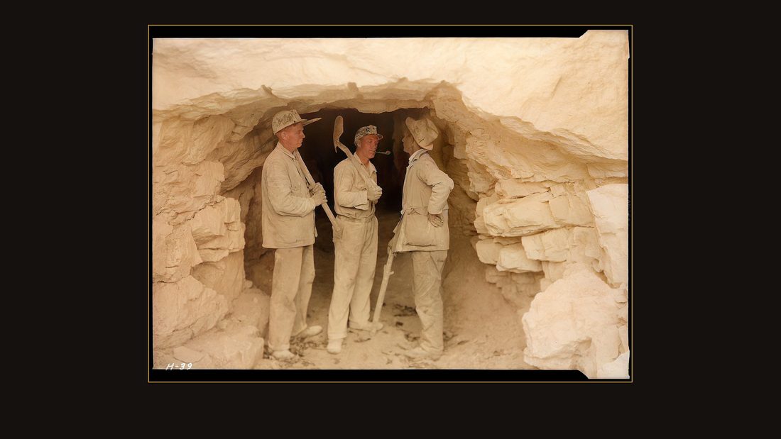 "Foreman Clark and two of the shaftmen, Arthur Roberts and Sam Mynatt, at the mouth of the test tunnel at Norris Dam site."