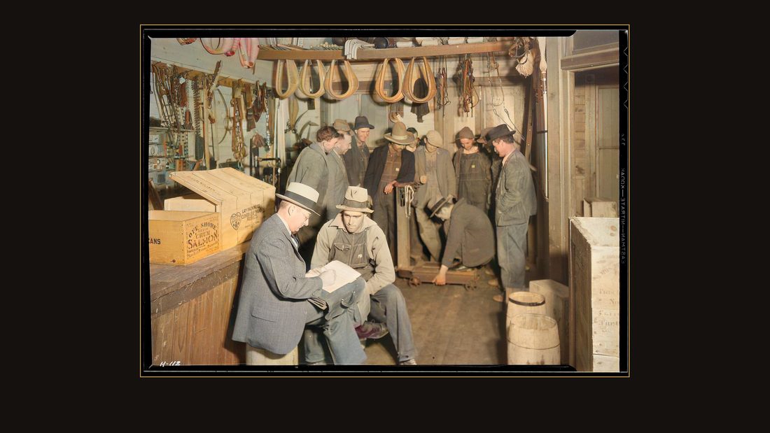 "E. H. Elam, interviewer for the TVA, making personal interviews at Stiner's Store, Lead Mine Bend, Tennessee, with applicants for work on Norris Dam. The group in the ba