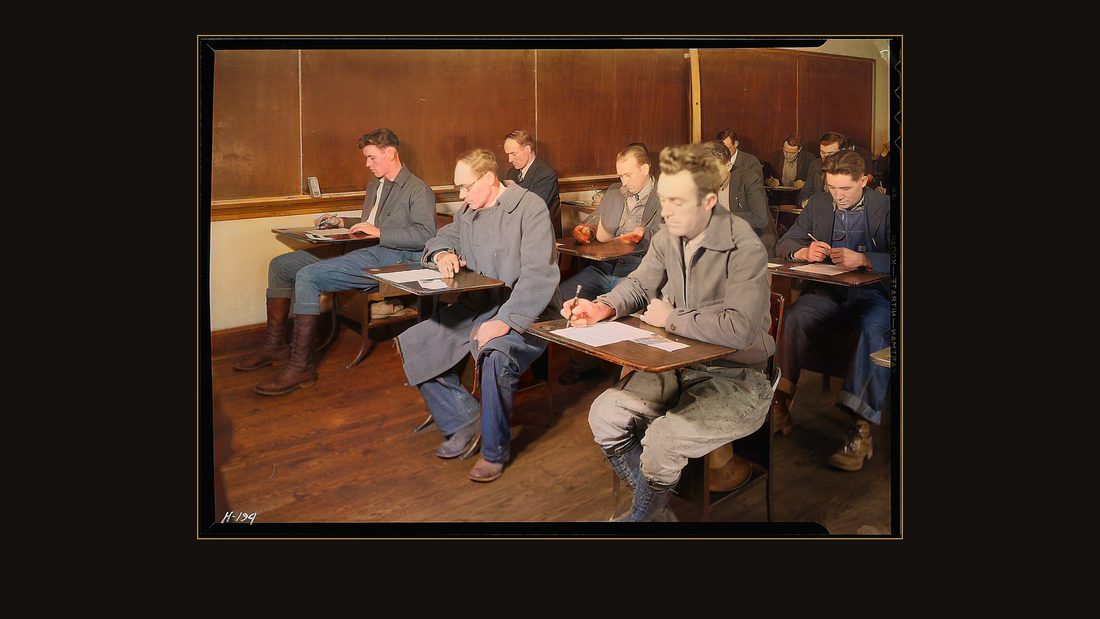 "Applicants for skilled and unskilled laboring positions with the TVA being examined at High School building, Clinton, Tennessee. Mr. McDade, of TVA Division of Personnel, in