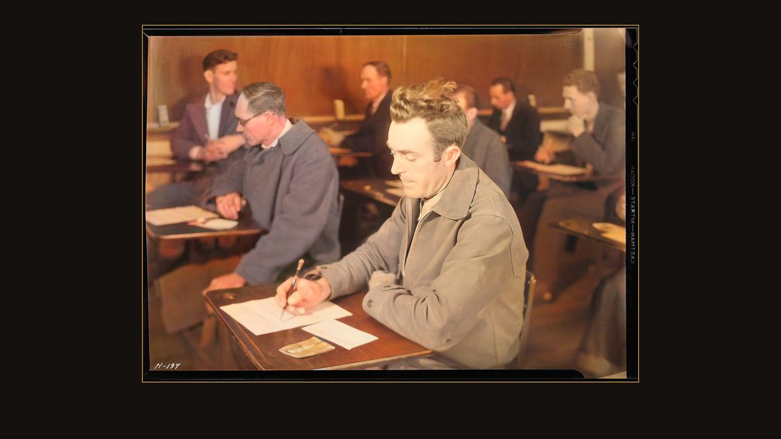 "Close-up of an applicant for employment with the TVA taking the examination for skilled and unskilled labor at the high school building, Clinton, Tennessee."