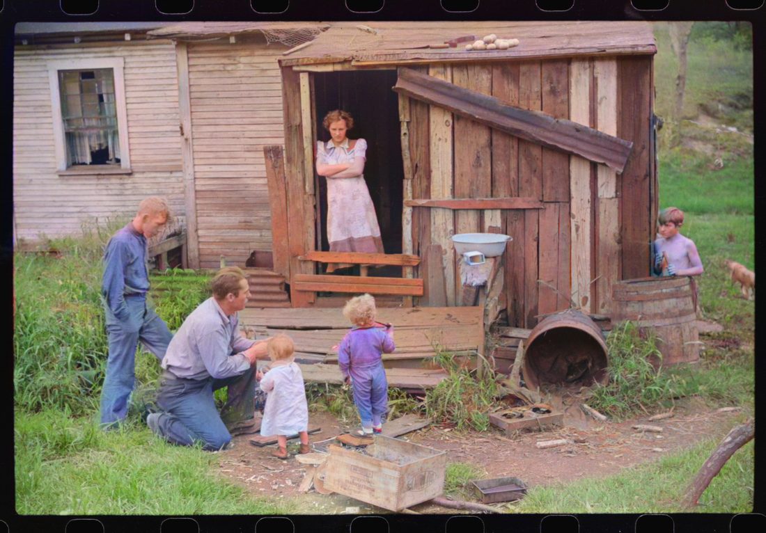 Coal miner and some of his family in back of their home. Bertha Hill, West Virginia