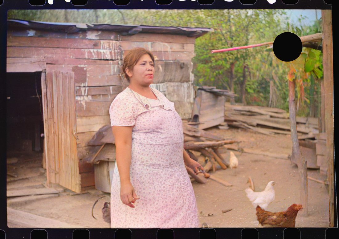 [Untitled photo, possibly related to: Mexican miner's wife and child are visited by another miner's wife (Hungarian) who is interested in starting a maternal health clini