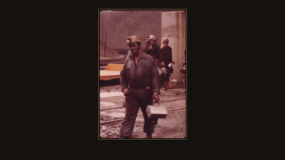 MINER, WHO HAS JUST FINISHED HIS SHIFT AT VIRGINIA-POCAHONTAS COAL COMPANY MINE #4, NEAR RICHLANDS, VIRGINIA. CARRIES HIS EMPTY LUNCH PAIL. THE BRASS PLATE ON HIS BELT CARRIES HIS