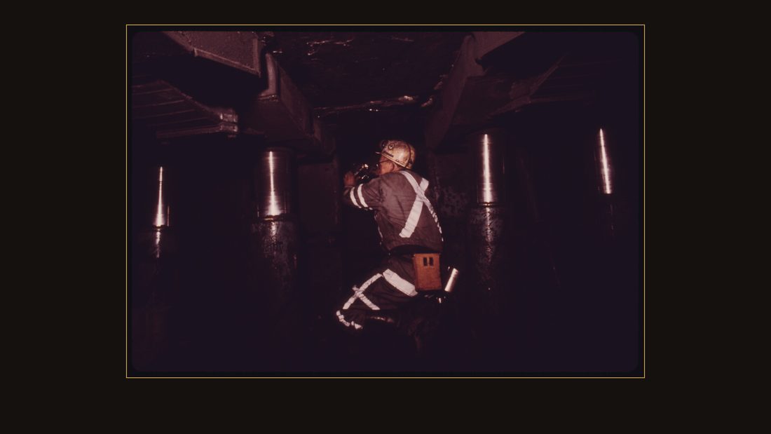 SHERMAN M PHIPPS IS A FEDERAL COAL MINE INSPECTOR WHO IS CHECKING FOR METHANE GAS AMONG THE LONG WALL JACKS HOLDING UP THE CEILING IN VIRGINIA-POCAHONTAS COAL COMPANY MINE #3. EMPL