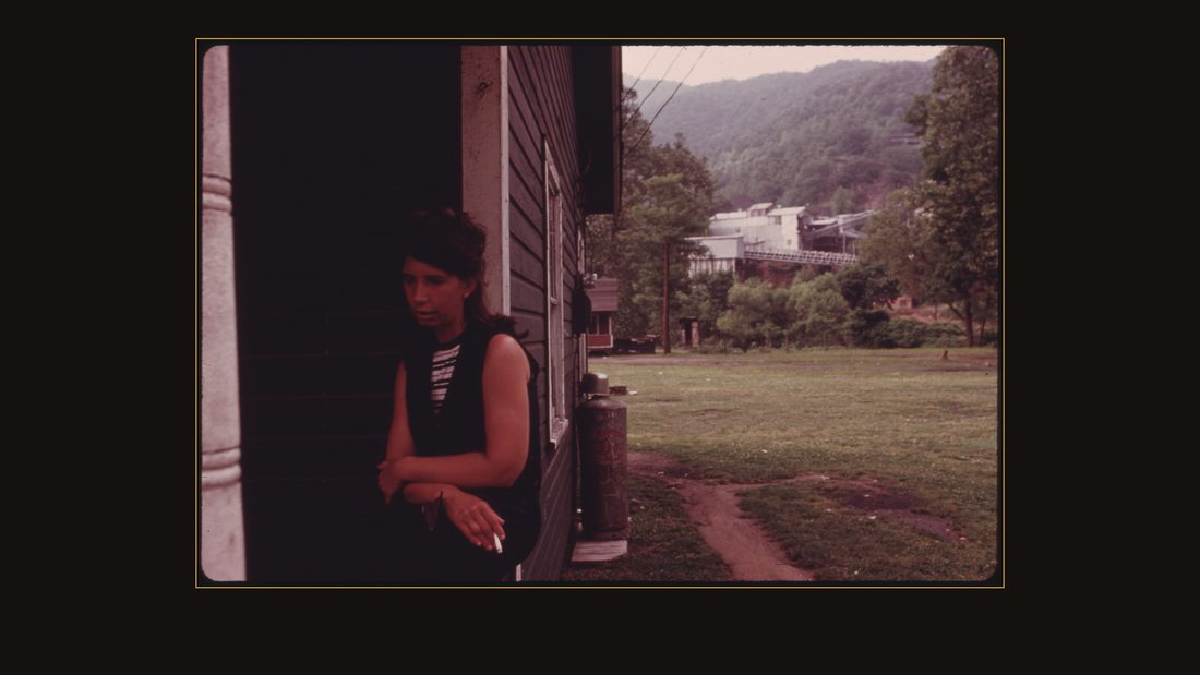 NANNIE RAINEY, 34, WIFE OF MINER JERRY RAINEY, WHO LIVES IN HOUSING OWNED BY THE BROOKSIDE MINE COMPANY NEAR MIDDLESBORO KENTUCKY. THE COMPANY IS OWNED BY THE DUKE POWER COMPANY. S