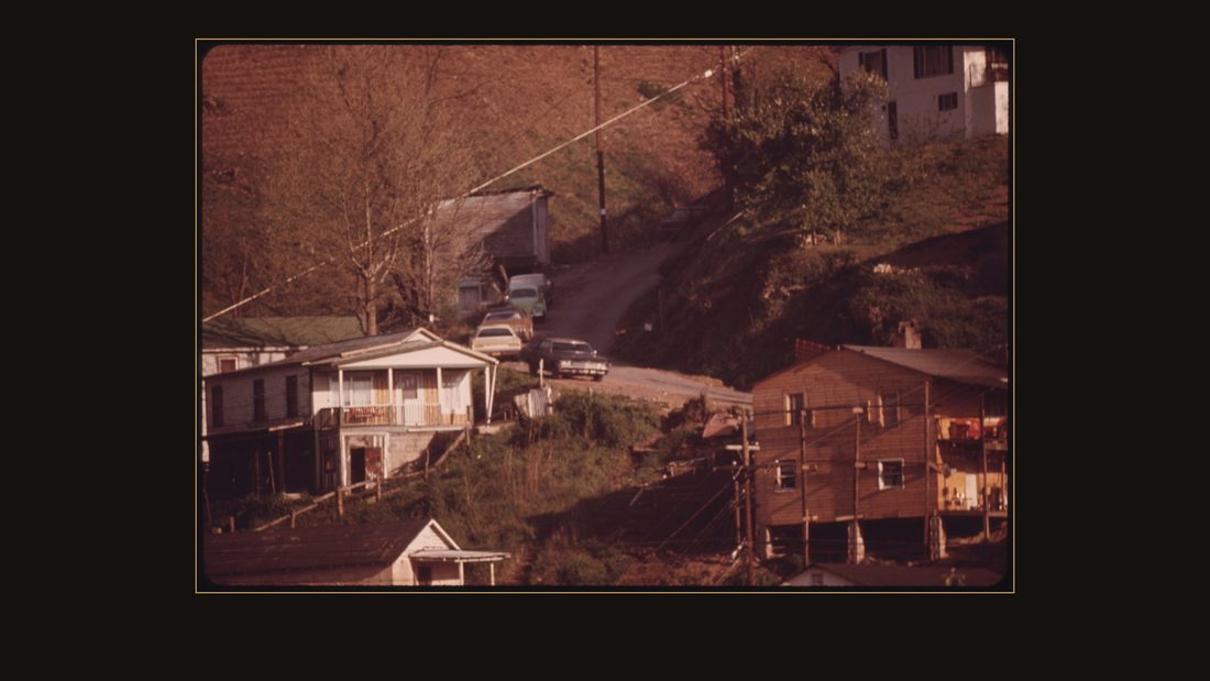 HOUSES PERCHED ON A HILLSIDE AT LOGAN, WEST VIRGINIA. MANY HOMES ARE BUILT THIS WAY BECAUSE LEVEL LAND IS AT A PREMIUM IN THE VALLEYS OF THIS COAL MINING AREA. AS A RESULT MANY OF